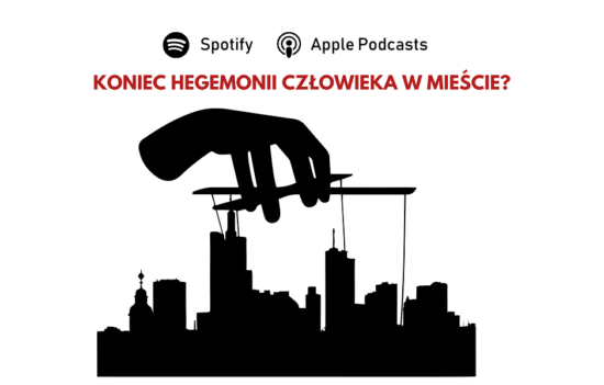 Kontury budynków typowego dużego miasta (bloki, drapacze chmur) - nad nimi ręka która "pociąga za sznurki" jak w teatrze kukiełkowym. U góry pytanie: Koniec hegemonii człowieka w mieście?